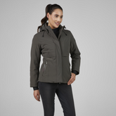 Woman wearing a khaki jacket on a grey background